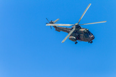Helicopter military aircraft flying blue sky public event summers dayのeditorial素材