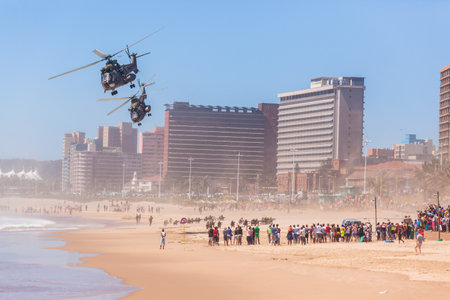 Helicopters dropping armed forces soldiers on beach military public event on Durban beach's.のeditorial素材