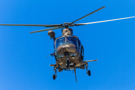 Helicopter military aircraft flying blue sky public event summers dayのeditorial素材