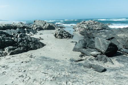 Ocean coastline vintage cold tone rocks sea horizon water landscapeの写真素材