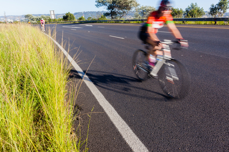 Cyclist cycling motion speed blur road raceの写真素材