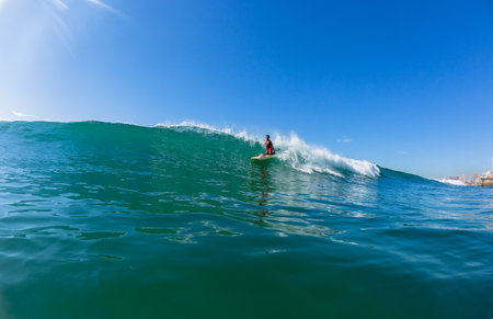 Surfing lifeguards on the rescue paddle skis closeup water action North Beach Durban South-Africa.のeditorial素材