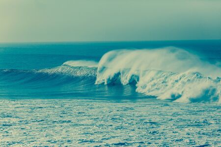 Waves crashing ocean water power cross process photoの写真素材
