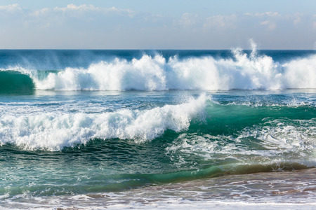 Beach shoreline blue ocean waves closeup scenic nature horizon landscape.の写真素材