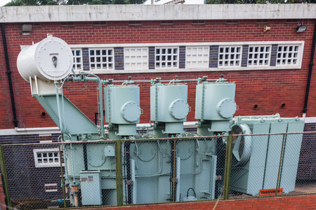 Electricity power oil transformer unit outdoors of sub station close-up photo.のeditorial素材