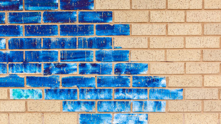 Wall closeup clay bricks plaster painted assorted of blue colors abstract background outdoors.