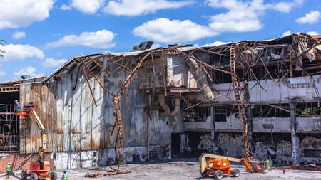 Factory building burned ruins from fire arson looting of three floor business detroyed by political...