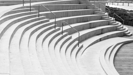 Outdoors amphitheater open air concrete arena seating steps empty for shows entertainment arts performances at the beach.の写真素材