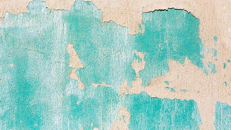Wall paints peeling colors of cream white, turqouise, weather worn elements for texture abstract background.の写真素材