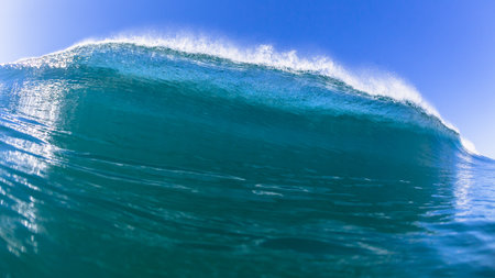 Ocean Wave Swimming inside a water photograph closeup encounter of crashing sea  power along beach coastline.の写真素材