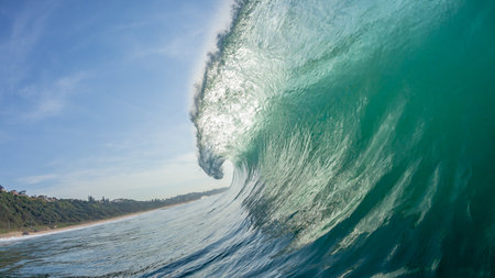 Ocean wave swimming inside crashing water close up water coastline detail.の写真素材