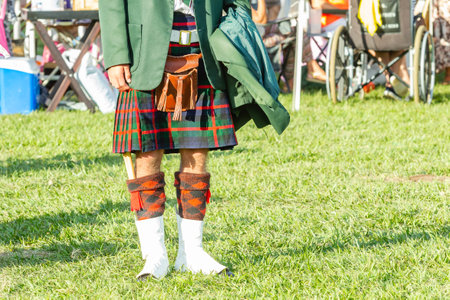 Scottish band musician unrecognizable member dress attire kilt colours  at highland games photograph...
