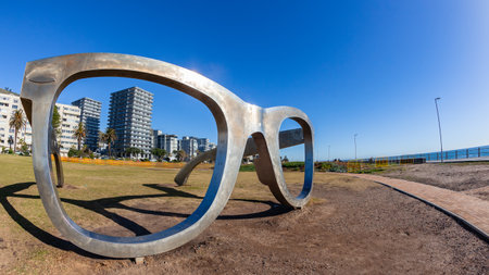 Sunglasses Realistic Large steel framed design sculpture on ocean sea coastline promenade for public...