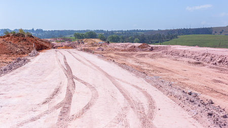 Construction New Roads Earthworks layout landscape moving sand compressing surfaces with heavy machines outdoors countryside economy expansion projects.の写真素材