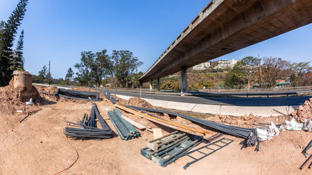 Construction Industrial Road Highways Steel raw materials on site for expansion of ramp flyover projects landscape.の写真素材