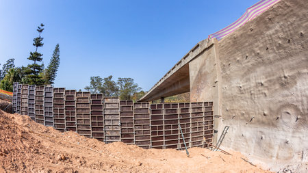 Industrial Road Highway Expansion of Ramp Flyover foundations panels scaffolding materials at earthwork site  on going project landscape close-up photograph.の写真素材
