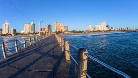 Durban beachfront perspective from North Beach pier jetty morning blue sky scenic holiday landscape.の写真素材