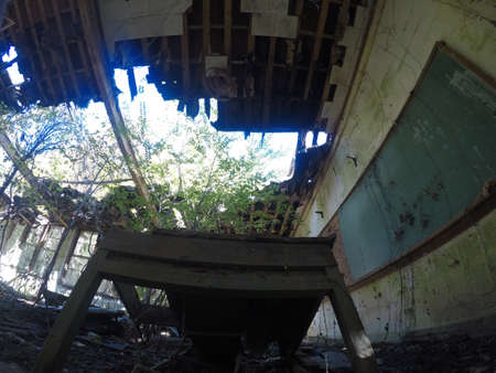 deteriorated light fixture and building debrisの写真素材