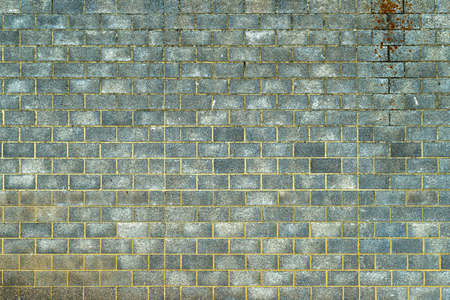 A blue and grey block work wall