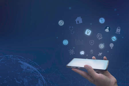 Businessman using a smartphone with a Contact icon application, Hand holding smartphone, media icons...