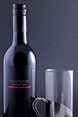 Mulled wine and glass with black background.の写真素材