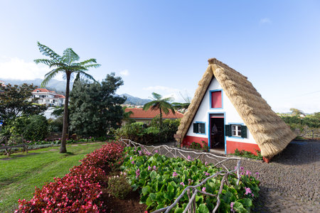 a tourist-themed park with old houses in the village of Santana (Madeira, Portugal)の写真素材