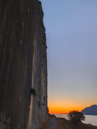 beautiful sunset at the beach of Plakias, close to the Plakias main climbing wall (Crete, Greece)の写真素材