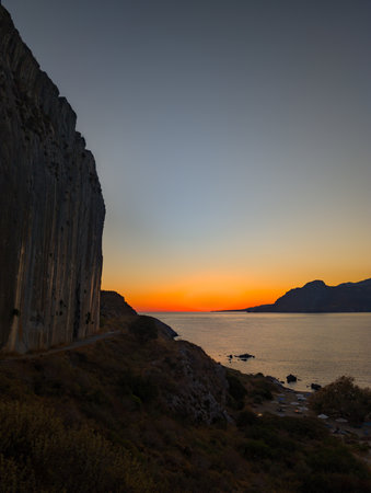 beautiful sunset at the beach of Plakias, close to the Plakias main climbing wall (Crete, Greece)の写真素材