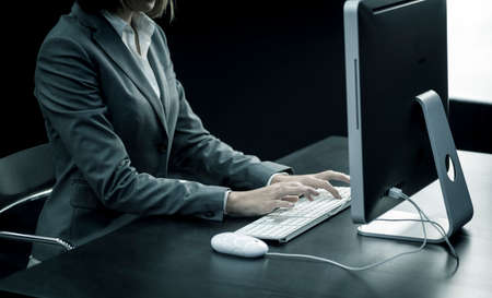 Businesswoman typing at computerの写真素材