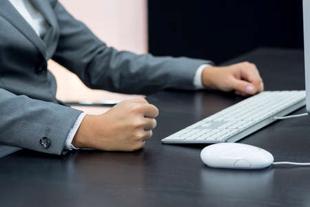 Businesswoman typing at computerの写真素材