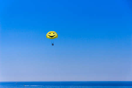 Parasailing over the Adriatic sea, beautiful sunny day. Budva, Montenegro.の写真素材