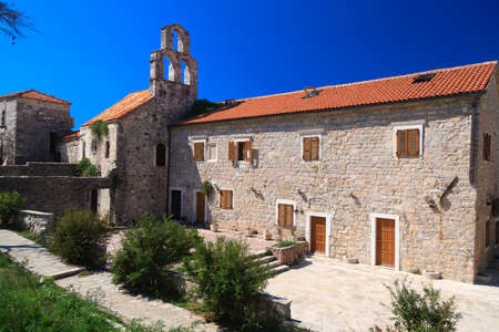 The Church of Santa Maria is the oldest church in Budva. Stone walls and red tile roof. Montenegro.の写真素材