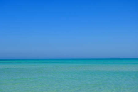 Clear turquoise sea, blue sky. Northern Qatar.