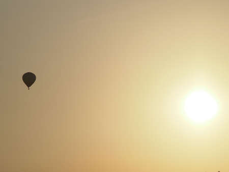 sunrise with hot-air balloonの写真素材