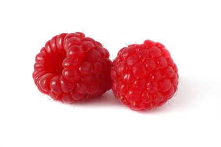 two ripe, sweet rasperries isolated on white background 