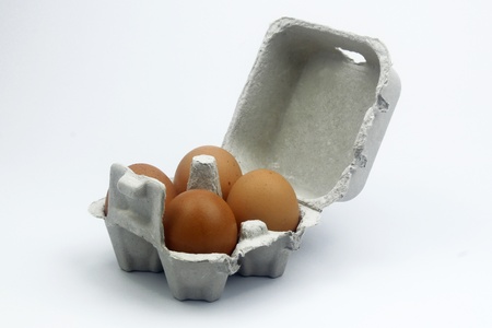 eggs in box isolated on white の写真素材