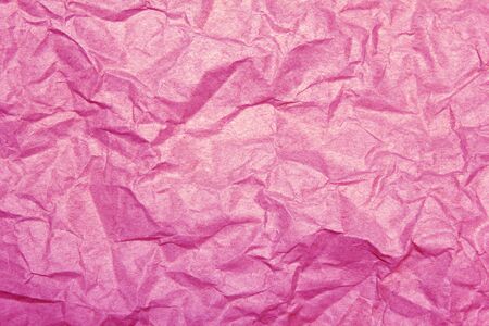 pink crumpled paper background の写真素材