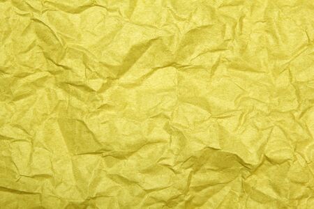 yellow crumpled paper background の写真素材