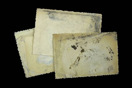 three old photo frames on black background 