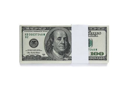 packed one hundred dollar bills isolated on white background の写真素材