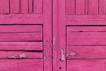 closeup of old pink wooden doorの写真素材