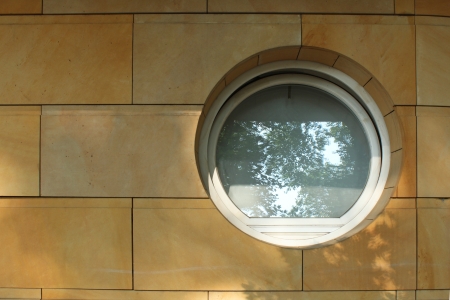 round vintage window on a marble wallの写真素材