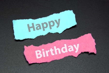Happy Birthday text on torn paper の写真素材