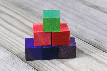 podium or tower of wooden colorful blocks