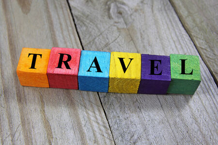 concept of travel word on wooden colorful cubesの写真素材