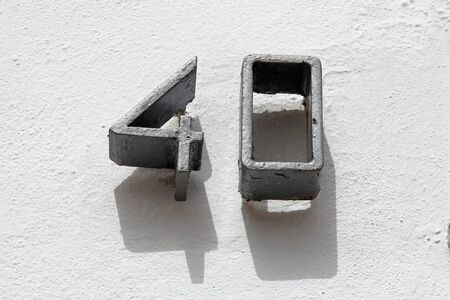 Number forty on white wallの写真素材