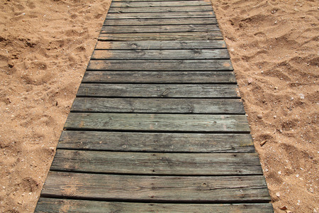 Wooden path in sandの写真素材