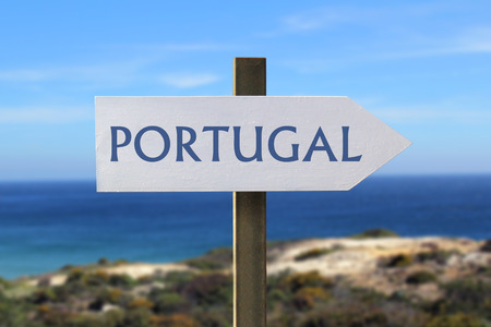 Portugal sign with the seashore in the backgroundの写真素材