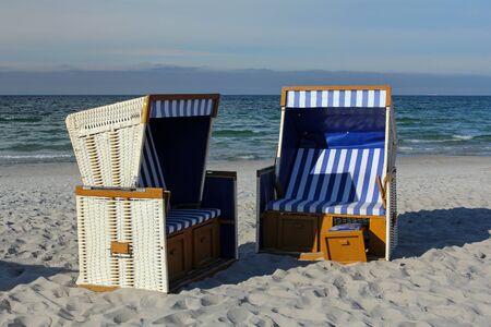 sunbathing empty baskets (chairs) on baltic beachの写真素材