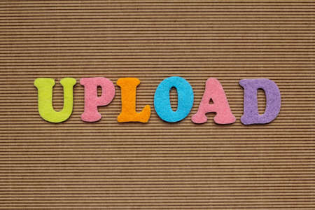 word upload on cardboard backgroundの写真素材